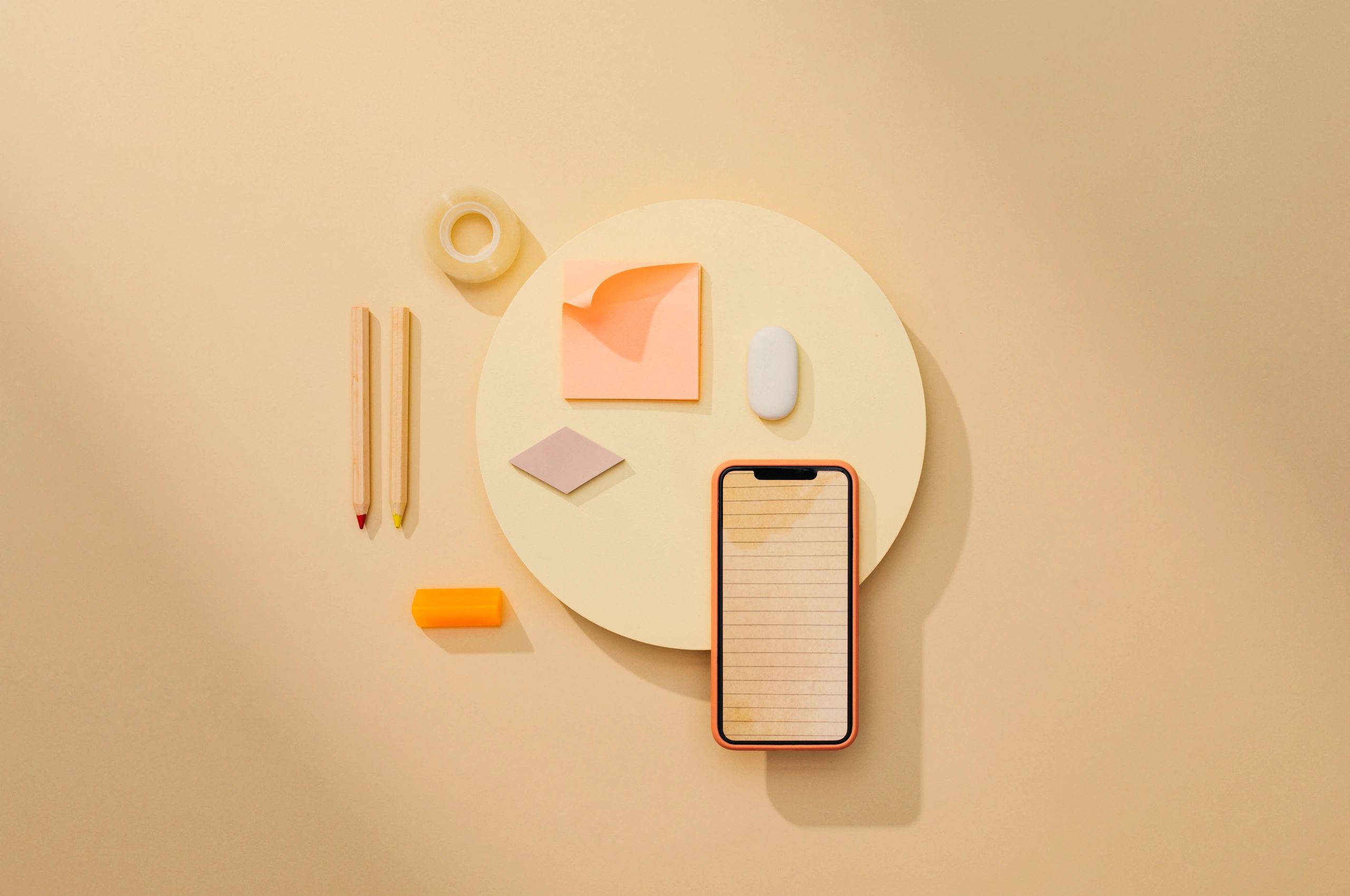 Flat lay of office supplies and smartphone