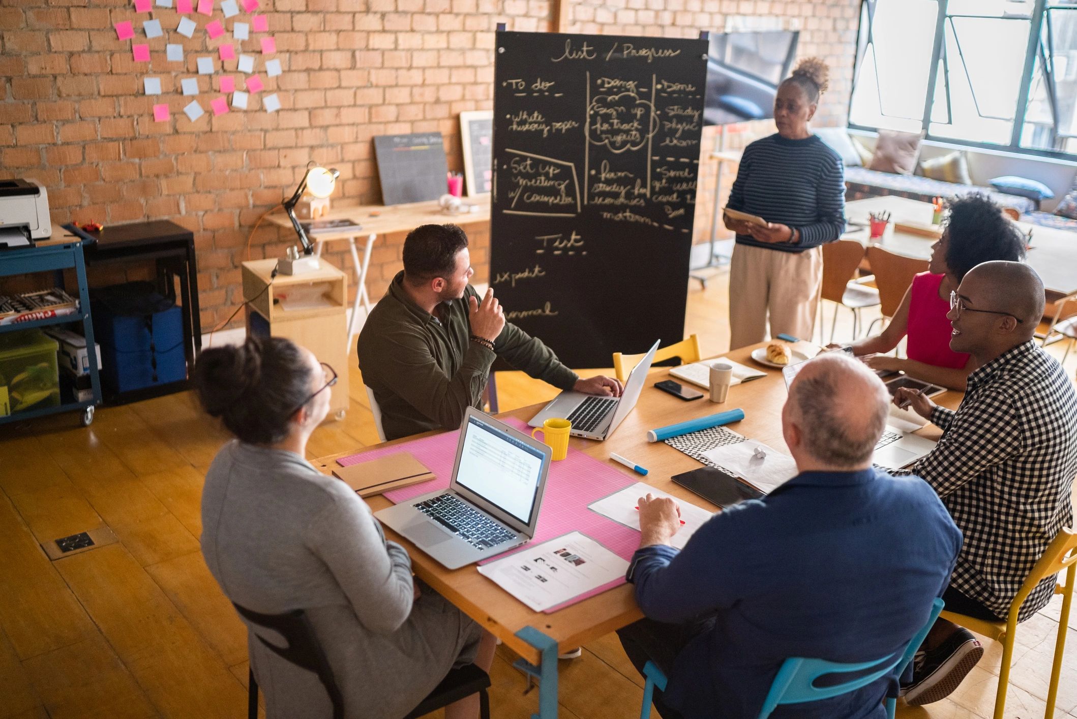 Professional portrait of a woman speaking in a meeting