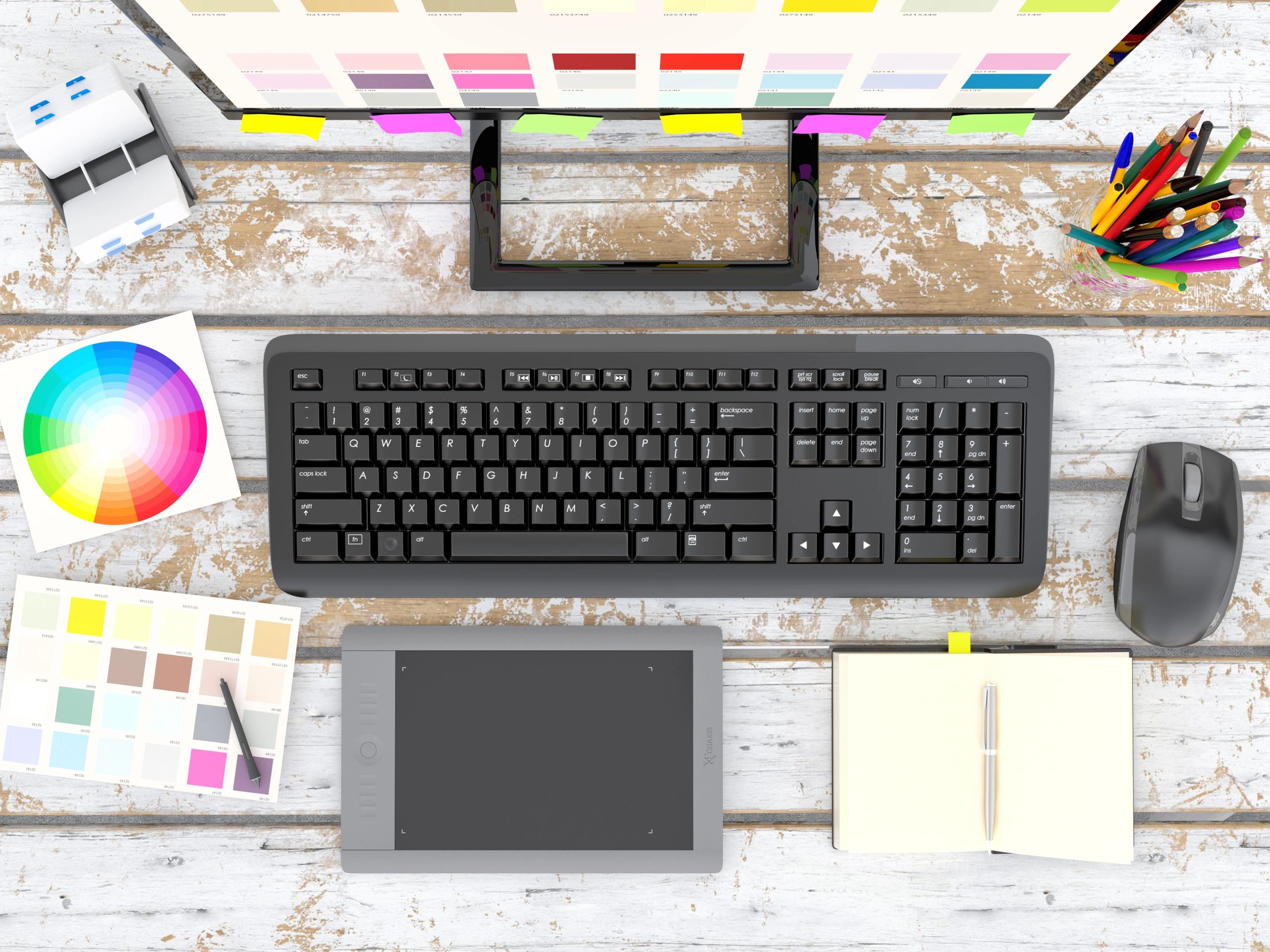 Graphic designer desk with tools and computer